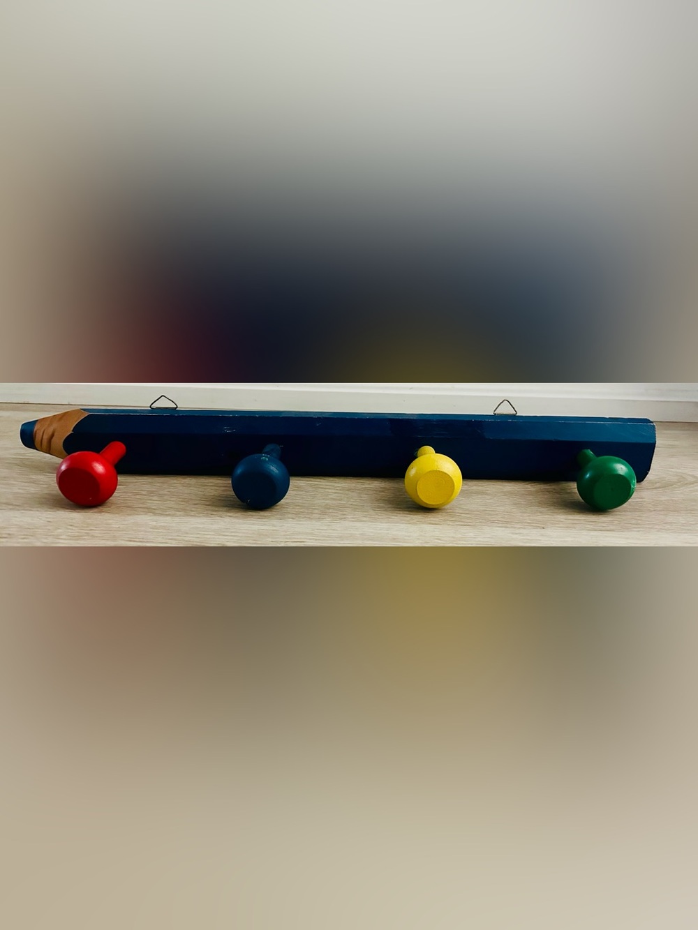 VINTAGE wall-mounted pencil-shaped wall coat rack with 4 primary colorful knobs.